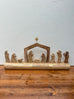 Nativity Scene On Carved Wood Log