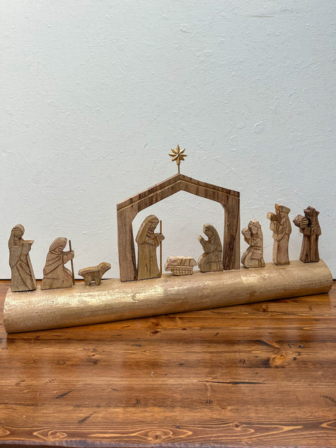 Nativity Scene On Carved Wood Log
