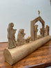 Nativity Scene On Carved Wood Log